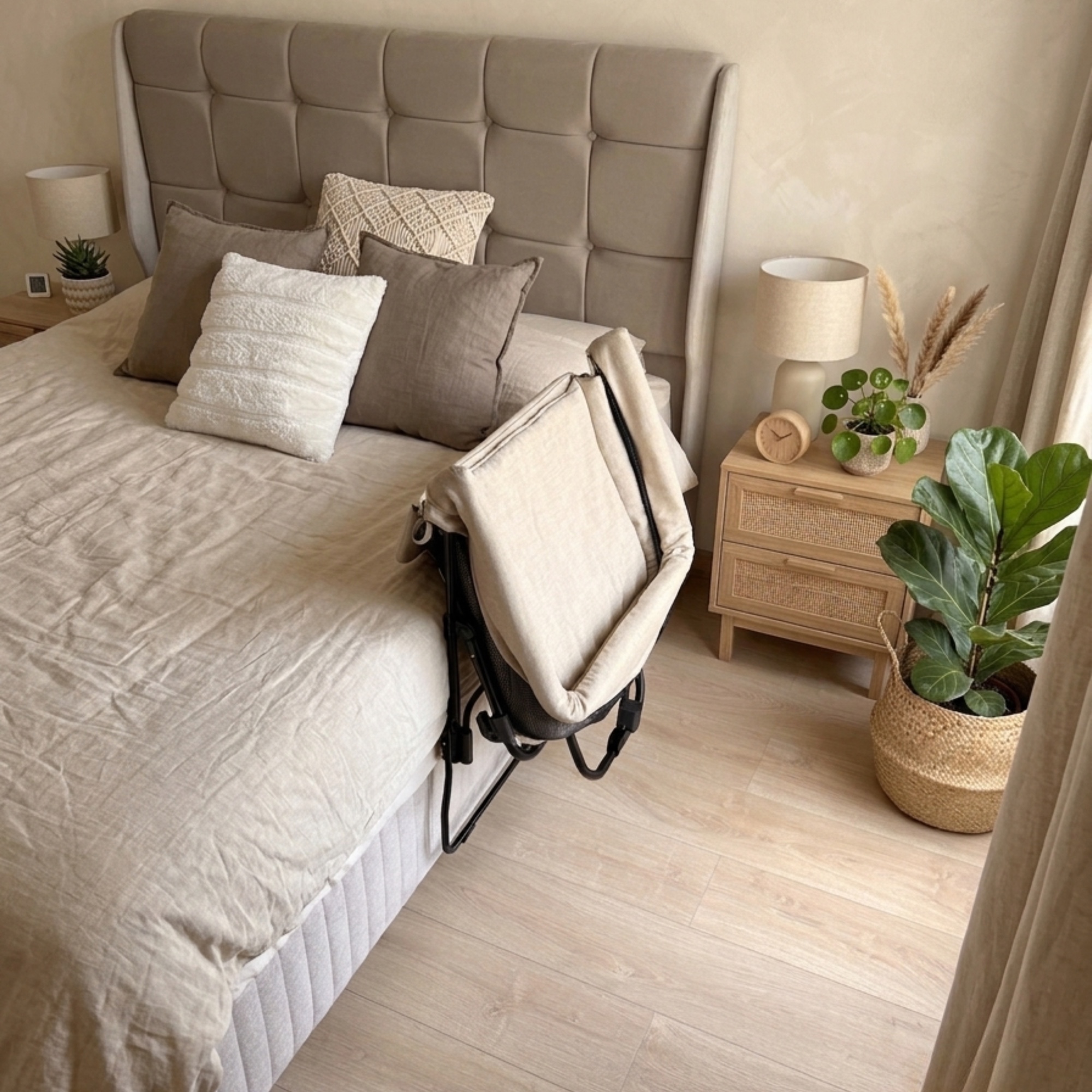 The co-sleeper folded down while still attached to the bed